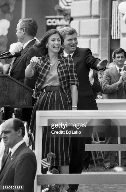 Married couple Marilyn Quayle and American politician Dan Quayle and wave from a podium during a campaign rally, Huntington, Indiana, August 18,...