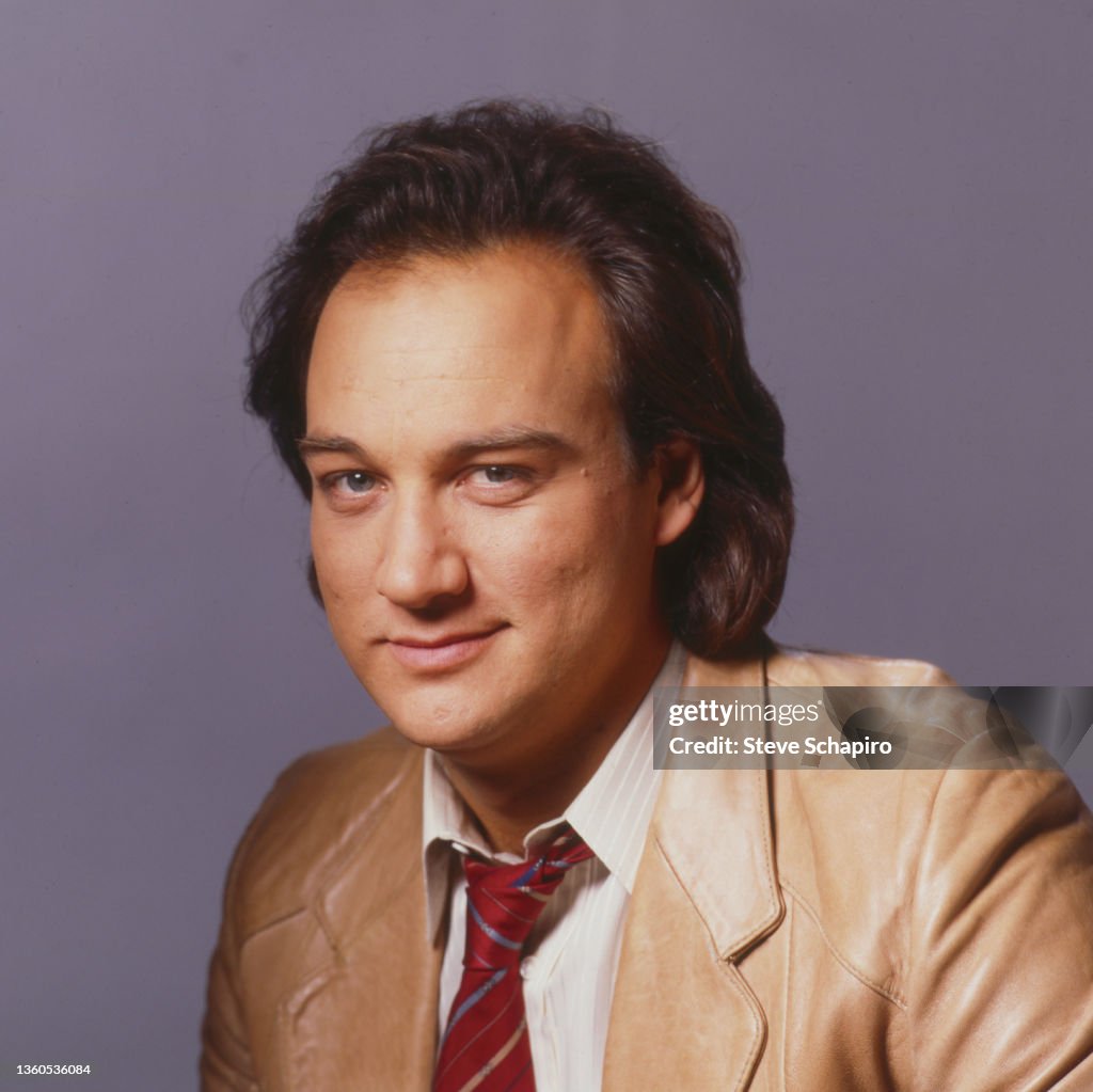 Portrait of American actor Jim Belushi as he poses in a blazer and