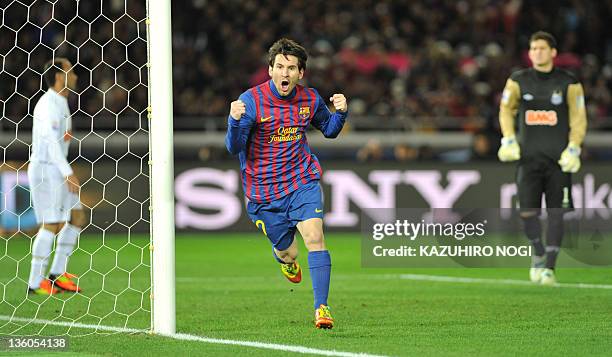 Barcelona striker Lionel Messi celebrates is goal against Santos during the final football match of the FIFA Club World Cup in Yokohama on December...