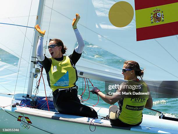 Tara Pacheco and Berta Betanzos of Spain celebrate their win in the 470 Women's Two Person Dinghy medal race on the Centre Course during day 16 of...