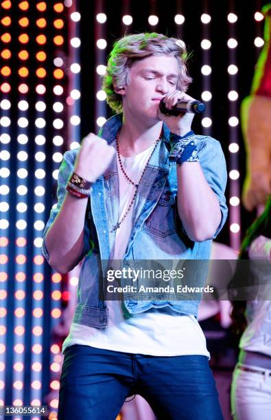 Singer Cody Simpson performs onstage at The Salvation Army's Red Kettles 2nd Annual "Rock The Red Kettle" Holiday Concert at 5 Towers Outdoor Concert...