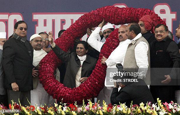 Uttar Pradesh Chief Minister Mayawati waves her hands towards a crowd during an election campaign rally in Lucknow December 18, 2011. Around 50,000...
