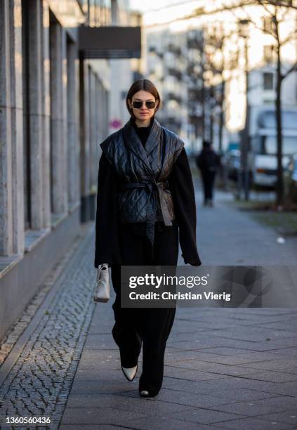 Jacqueline Zelwis is seen wearing Leger by Lena Gerke Hose & jumper, Gestuz vest, Toral Boots, 3.1 Phillip Lim bag, Gigi Studios sunglasses on...