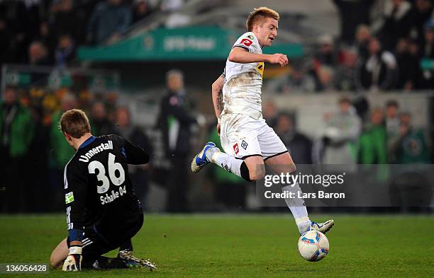 Marco Reus of Moenchengladbach is on his way to score his teams third goal during the DFB Cup round of sixteen match between Borussia...