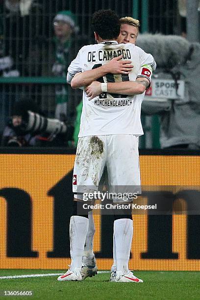 Marco Reus of Moenchengladbach celebrates the third goal with Igor de Camargo of Moenchengladbach during the DFB Cup round of sixteen match between...