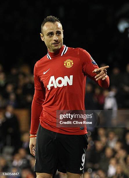 Dimitar Berbatov of Manchester United celebrates his team's fifth goal during the Barclays Premier League match between Fulham and Manchester United...