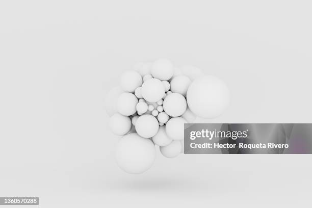 3d generated image of close-up of white  balls on white background - abstract science stockfoto's en -beelden