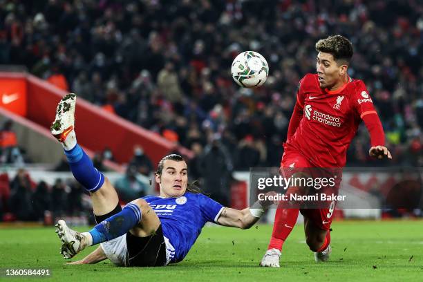 Caglar Soyuncu of Leicester City collides with Roberto Firmino of Liverpool during the Carabao Cup Quarter Final match between Liverpool and...