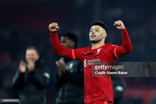 Alex Oxlade-Chamberlain of Liverpool celebrates with the fans following his teams victory ing the Carabao Cup Quarter Final match between Liverpool...