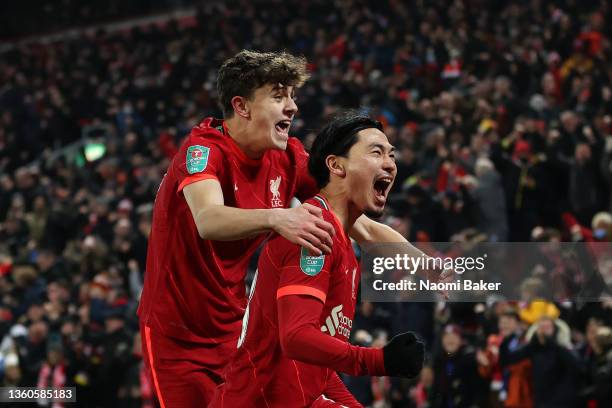 Takumi Minamino of Liverpool celebrates after scoring their team's third goal with Owen Beck of Liverpool during the Carabao Cup Quarter Final match...