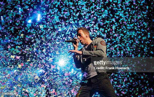 Singer Chris Martin of the band Coldplay performs live in concert during the Mylo Xyloto tour at the O2 World on December 21, 2011 in Berlin, Germany.