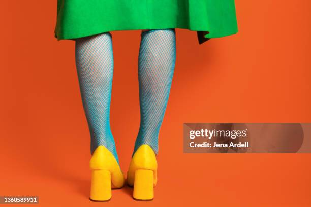 retro woman's legs, fashionable woman wearing heels, colorful woman - vintage nylon stockings stockfoto's en -beelden