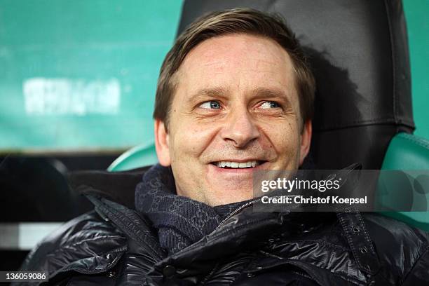 Manager Horst Heldt of Schalke looks on prior to the DFB Cup round of sixteen match between Borussia Moenchengladbach and FC Schalke 04 at Borussia...