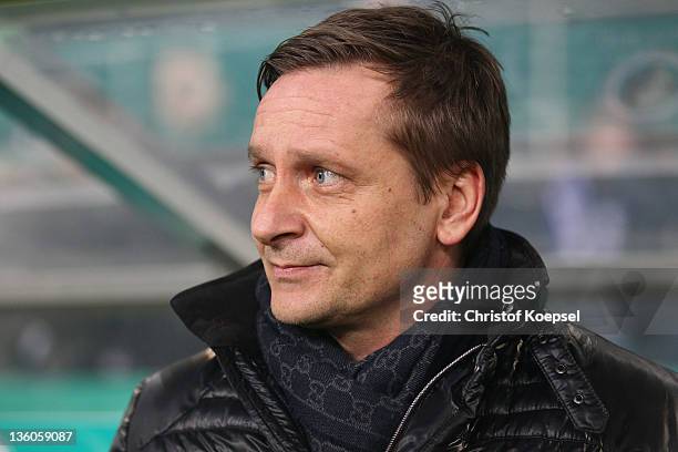 Manager Horst Heldt of Schalke looks on prior to the DFB Cup round of sixteen match between Borussia Moenchengladbach and FC Schalke 04 at Borussia...