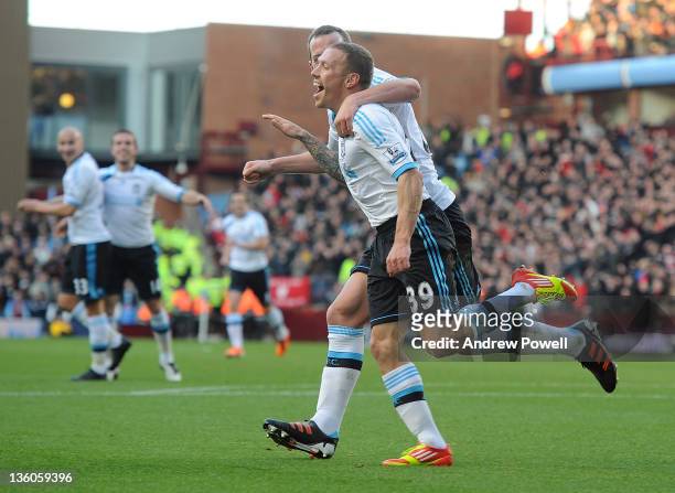 Craig Bellamy of Liverpool celebrates after scoring the opening goal during the Barclays Premier League match between Aston Villa FC and Liverpool FC...