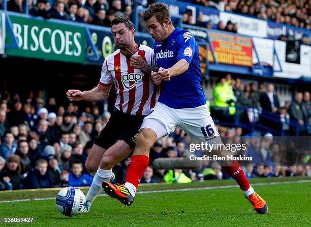 Frazer Richardson of Southampton battles with Joe Mattock of Portsmouth during the npower Championship match between Portsmouth and Southampton at...