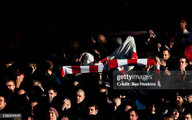 Southampton fans hold up flags prior to the npower Championship match between Portsmouth and Southampton at Fratton Park on December 18, 2011 in...
