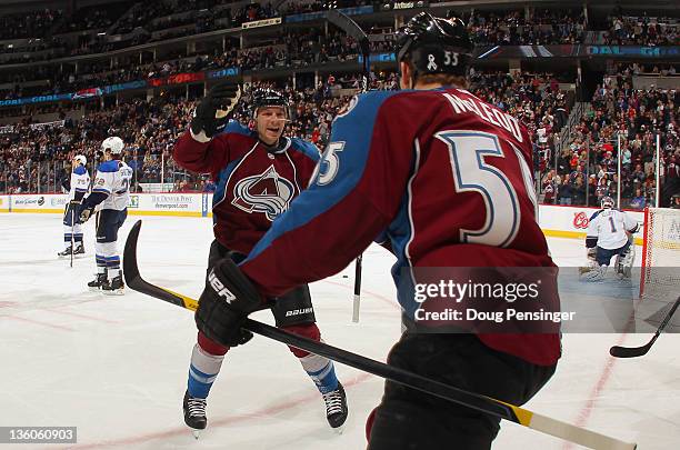 Cody McLeod of the Colorado Avalanche celebrates his first period goal with teammate Kevin Porter of the Colorado Avalanche as the Avalanche took a...