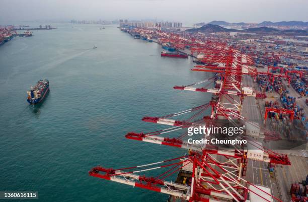 aerial view container cargo ship on terminal commercial port, business logistic and transportation industry in qingdao city, shandong province, china - shandong province stock pictures, royalty-free photos & images