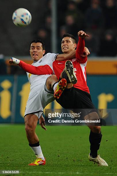 Juan Arango of Moenchengladbach and Malik Fathi of Mainz battle for the ball during the Bundesliga match between Borussia Moenchengladbach and FSV...