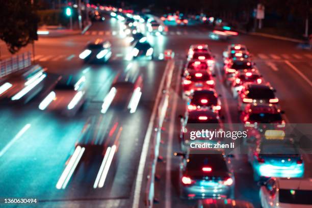 rush hour traffic on street in the evening - tail light stock pictures, royalty-free photos & images