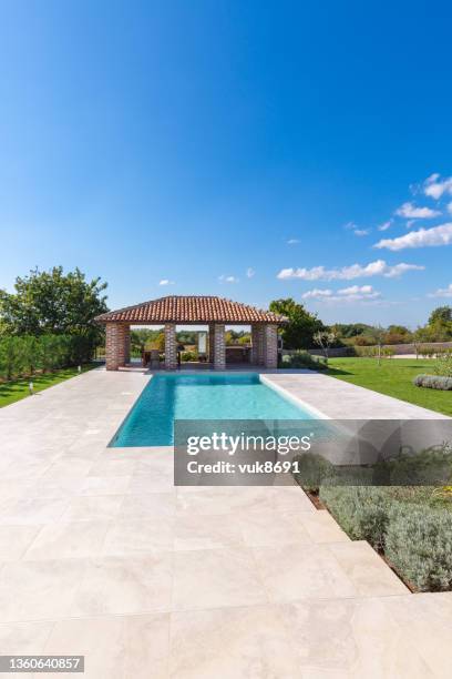 luxurious beautiful modern villa with swimming pool and yard garden - new patio stock pictures, royalty-free photos & images