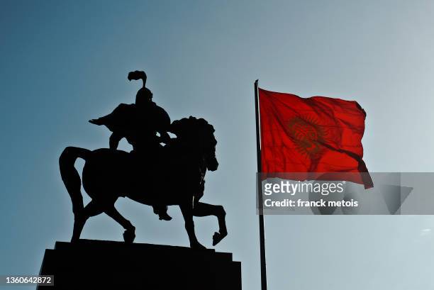 manas statue + kyrgyzstan flag ( kyrgyzstan) - bishkek stock pictures, royalty-free photos & images