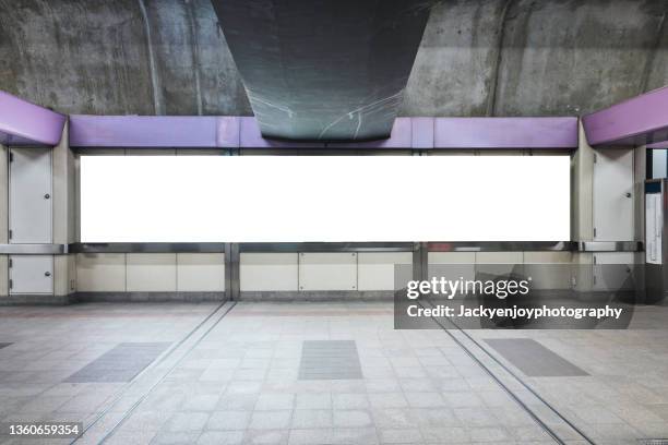 blank billboard on train station - poster wall stock-fotos und bilder