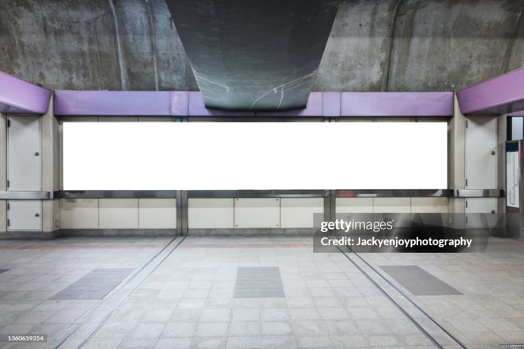 Blank billboard on train station