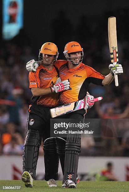 Shaun Marsh of the Scorchers celebrates hitting the winning runs with team mate Luke Ronchi during the T20 Big Bash League match between the...
