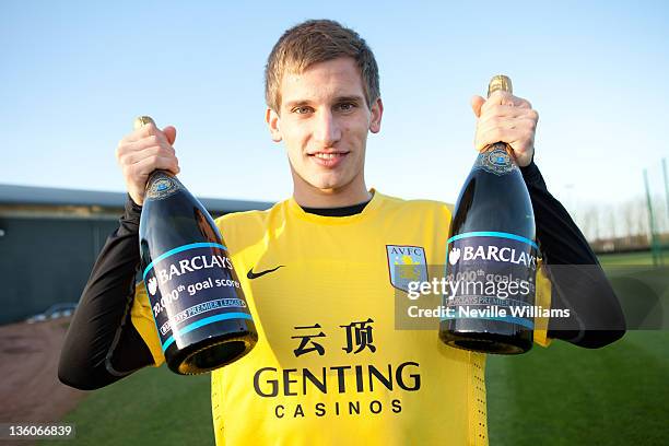 Marc Albrighton of Aston Villa is presented with a cheque to give to charity after scoring the 20,000th Premier League goal during the Premier League...