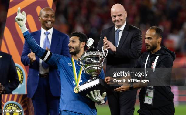 Al-Rayyan QATAR FIFA President Gianni Infantino looks on as Ahly's goalkeeper Mohamed el-Shenawy presents the winner's trophy to Ahly's goalkeeper...