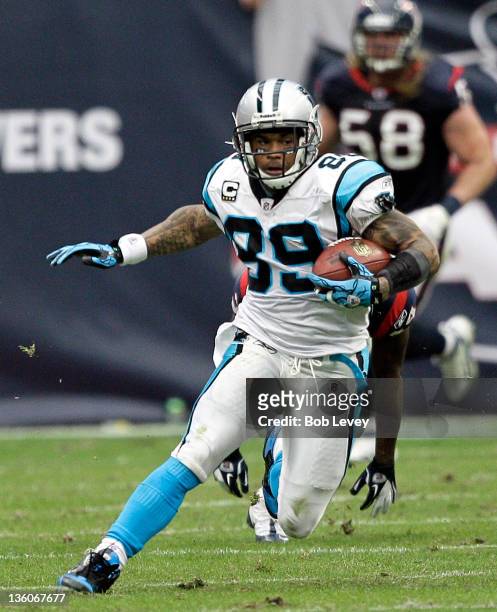 Wide receiver Bryant Johnson of the Carolina Panthers looks for room to run against the Houston Texans at Reliant Stadium on December 18, 2011 in...
