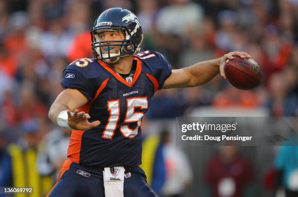 Quarterback Tim Tebow of the Denver Broncos delivers a pass against the New England Patriots at Sports Authority Field at Mile High on December 18,...