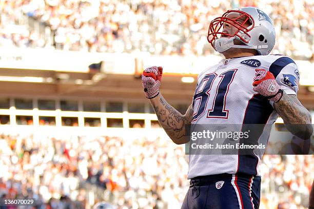 Tight end Aaron Hernandez of the New England Patriots celebrates after scoring a touchdown in the second quarter against the Denver Broncos at Sports...