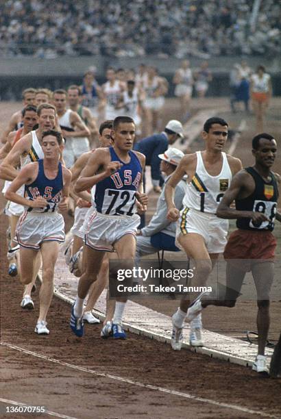 Summer Olympics: USA Billy Mills and Australia Ron Clarke in action during Men's 10,000M Final at National Olympic Stadium. Sequence. Tokyo, Japan...