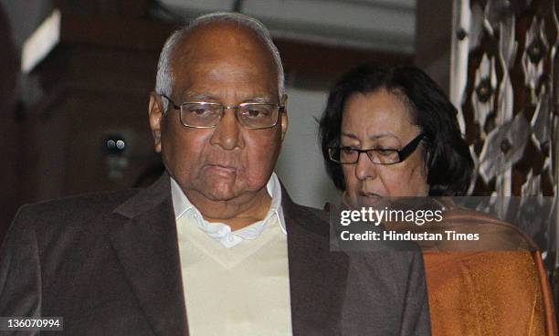 Sharad Pawar, Minister of Agriculture and BJP leader Najma Heptullah leave parliament house after attending the ongoing parliament winter session on...