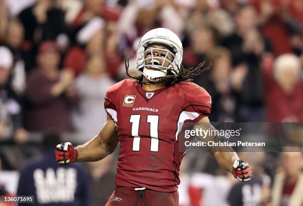 Wide receiver Larry Fitzgerald of the Arizona Cardinals celebrates after a 32 yard reception against the Cleveland Browns during overtime of the NFL...