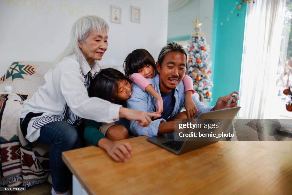 Happy family online shopping for Christmas