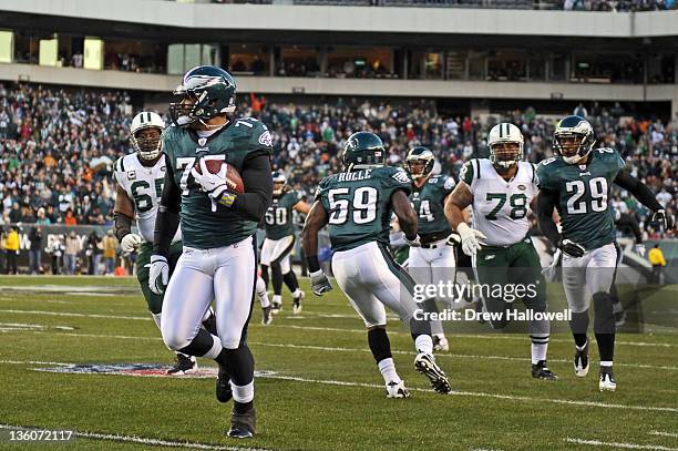 Juqua Parker of the Philadelphia Eagles runs for a touchdown after a fumble recovery during the game against the New York Jets at Lincoln Financial...