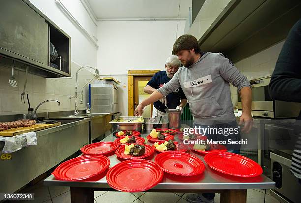 Chefs of the Restaurant, La Ragnatela prepare a Christmas Lunch for the Homeless at Centro Sociale Rivolta on December 22, 2011 in Venice, Italy....