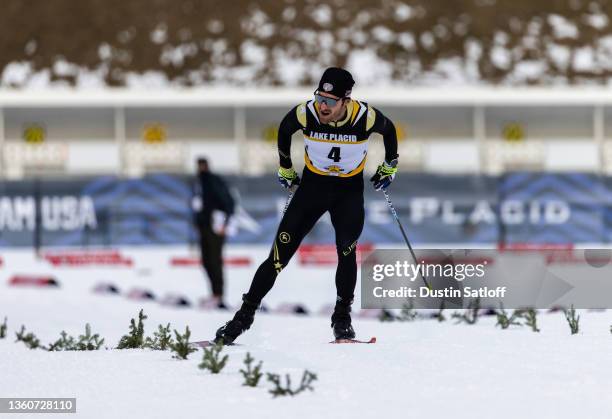 Taylor Fletcher of the United States celebrates as he approaches the finish line in first place after the 10km skate winning the Nordic Combined...