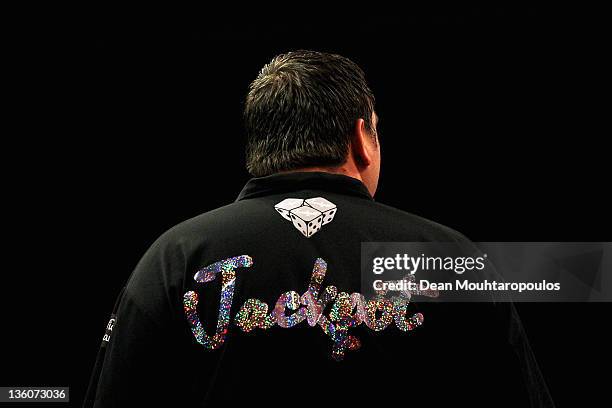 Detail veiw of the shirt with the word 'Jackpot' worn by Adrian Lewis of England as he gets his darts ready to throw in his match against Robert...