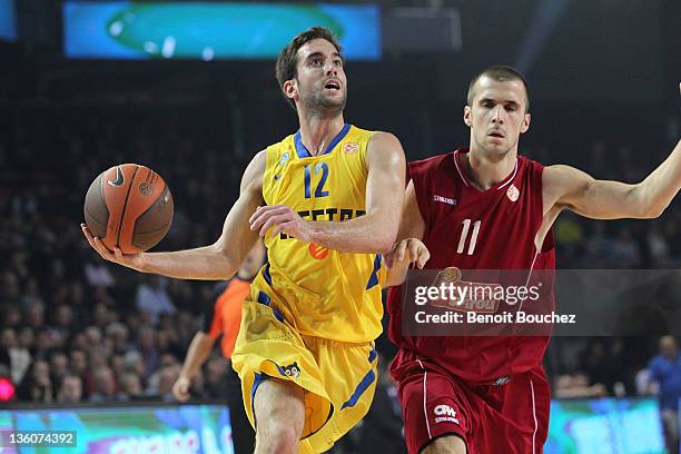 Yogev Ohayon, #12 of Maccabi Electra Tel Aviv competes with Amaury Jadin, #11 of Belgacom Spirou Basket during the 2011-2012 Turkish Airlines...