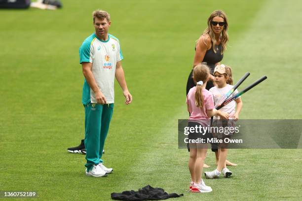 David Warner of Australia and wife Candice Warner are seen with their daughters Ivy Mae and Indi Rae during an Australian Ashes squad nets session at...