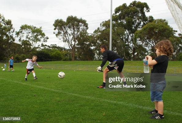Hendrix Reddy Marley Reddy shoots at goal past his father Liam Reddy as Hendrix ...