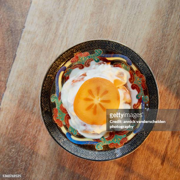 cottage cheese with persimmon - persimone stock-fotos und bilder