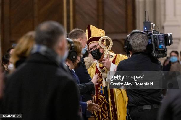 Cardinal Timothy Dolan greets NYPD Commissioner Dermot Shea during Midnight Mass on Christmas Eve at St. Patrick’s Cathedral on December 24, 2021 in...