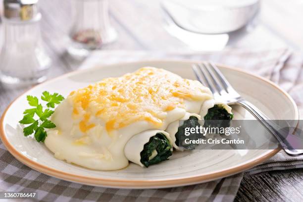 spinach cannelloni - bechamel sauce stock pictures, royalty-free photos & images