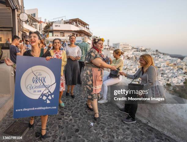 the greek wedding show (named play) in firá on santorini, greece - santorini wedding stockfoto's en -beelden